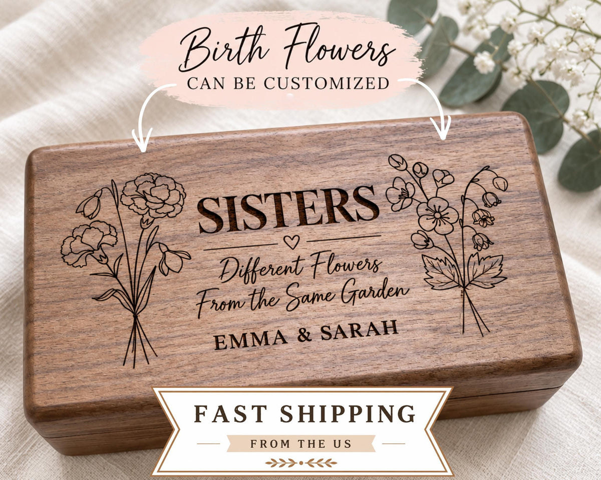 A wooden box with the text "SISTERS" engraved on it, along with illustrations of flowers. The box is labeled as customizable and can be shipped from the US.