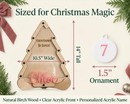 The image is a product advertisement for a Christmas-themed ornament. It features a wooden ornament labeled "Chloe" and provides measurements for the ornament, including a 14" tall wooden tree and a 15" ornament. The ad also includes a description of the product as a "Natural Birch Wood Clear Acrylic Front Personalized Acrylic Name".