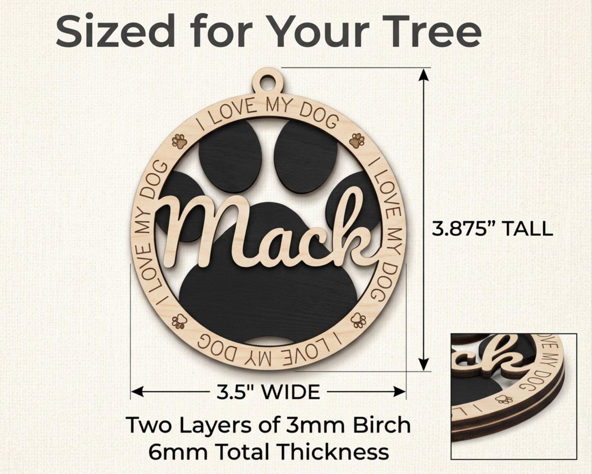 a dog's paw is engraved on the back of a wooden ornament