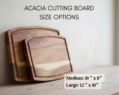 a pair of wooden cutting boards, one being a medium-sized cutting board and the other a larger cutting board, both resting on a wooden surface.