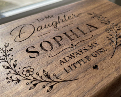A wooden box with a personalized message engraved on it, reading "To My Daughter Sophia always my little girl".