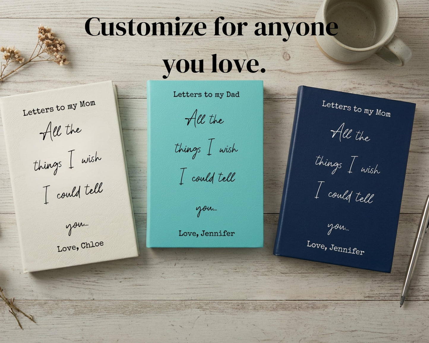 three books titled "Letters to my Dad" and "Letters to my Mom" with handwritten messages, placed on a wooden surface alongside a cup and a pen.