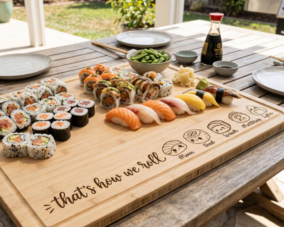 A wooden cutting board with various sushi rolls, including salmon and tuna rolls, as well as other sushi items, arranged on it. The cutting board also has a message that says "That's how we roll" written on it.