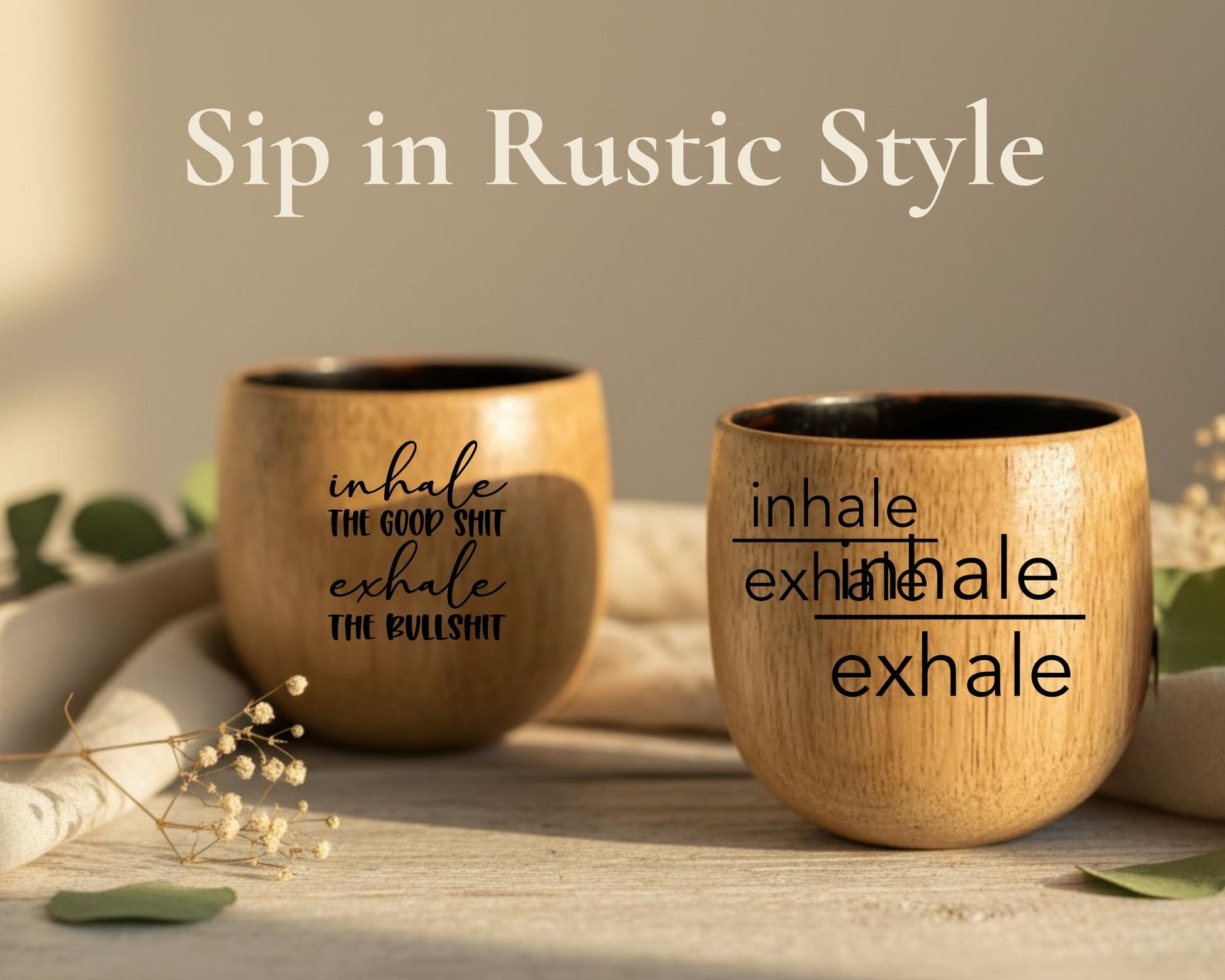 two wooden cups with humorous sayings on them, placed on a wooden surface with some greenery in the background.