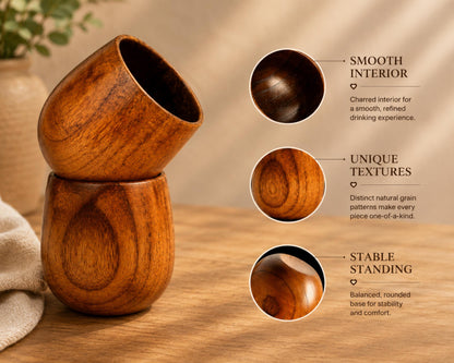 two wooden cups, one standing upright and the other tilted, showcasing their unique textures and natural grain patterns.