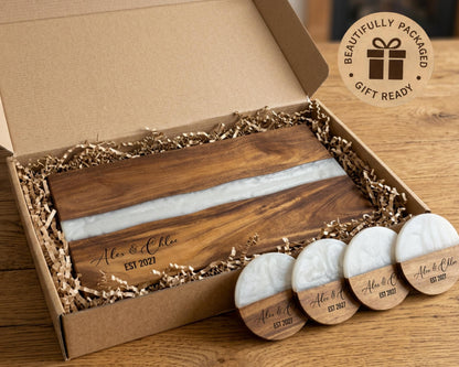 White pearl resin cutting board in a gift box with matching engraved coasters