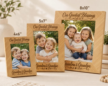 three wooden picture frames, each containing a family portrait of children and their grandparents. The frames are labeled with the sizes of the photos they contain, ranging from 5'7" to 4'6". The frames are placed on a table, with a plant and a vase visible in the background.
