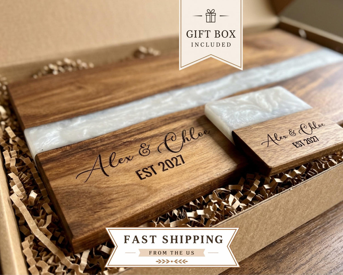 A gift box containing a wooden cutting board and a small wooden plaque, with the text "Gift Box Included" and "Fast Shipping from the US" printed on it.